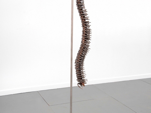 New Man, 2014 / Real handcuffs, cast bronze and stainless steel structure / 221.5 x  61 x 46 cm