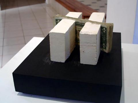 Intrinsic, 2006 / Plaster and dollar bills / 7 x 17 x 16 cm